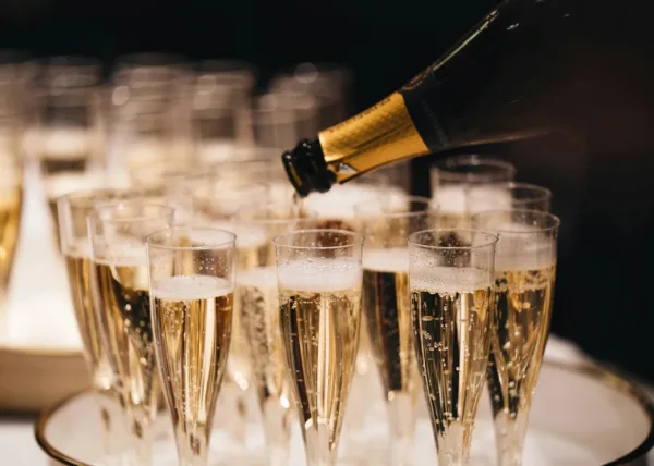 champagne sparkling wines being poured in glasses