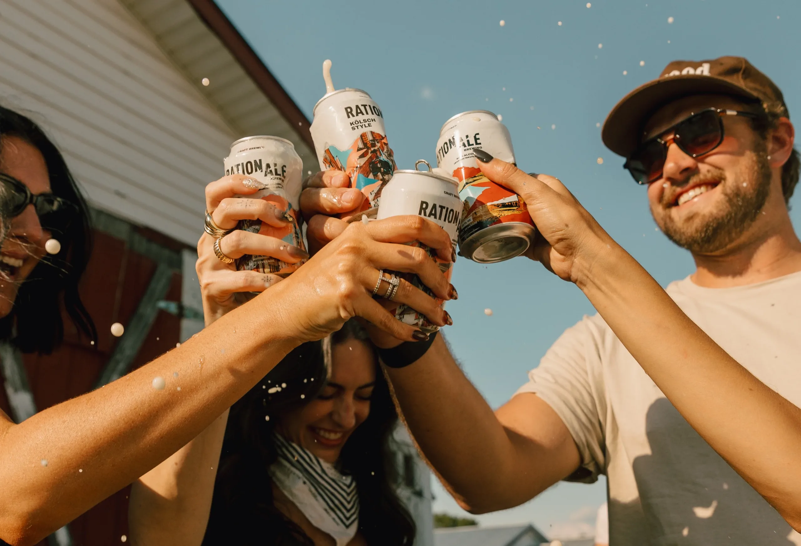rationale brewing cheers smashing cans together