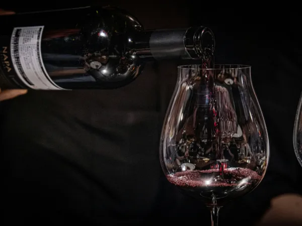 red wine pouring in glass