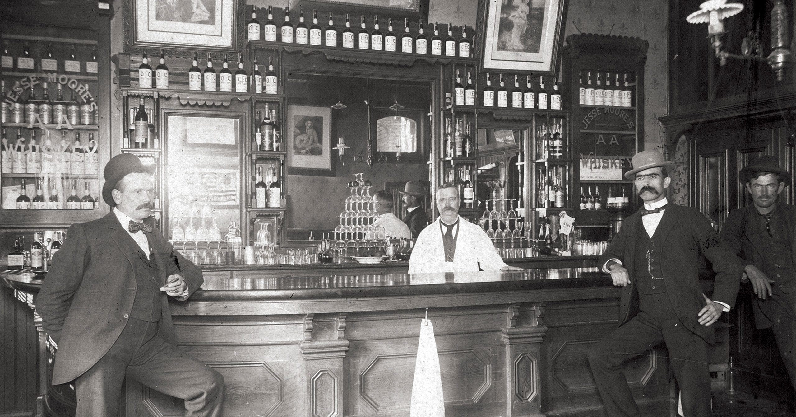 saloon with bar tender and patrons