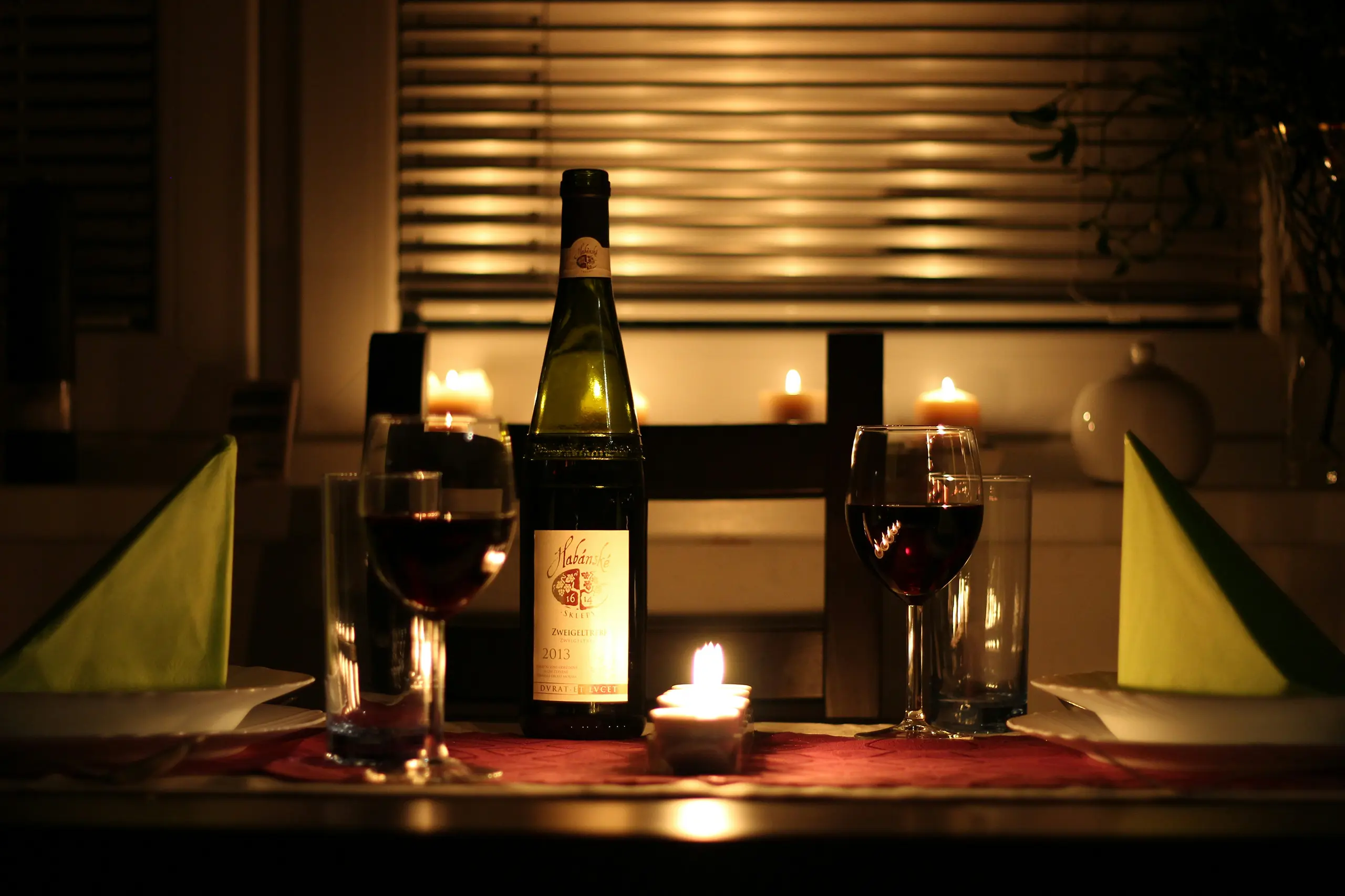 wine on table with candles